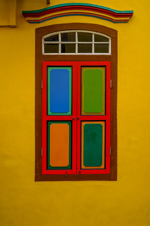 the building has many windows and colorful accents