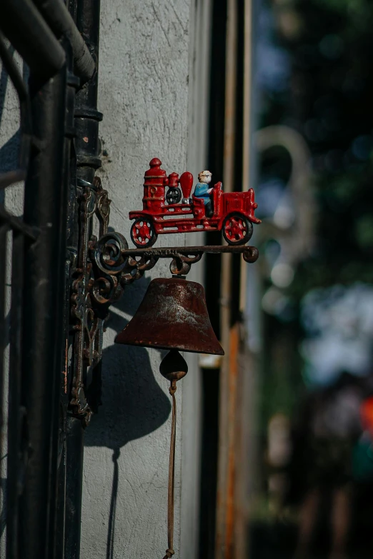 a lamp sitting on the wall next to a train on it