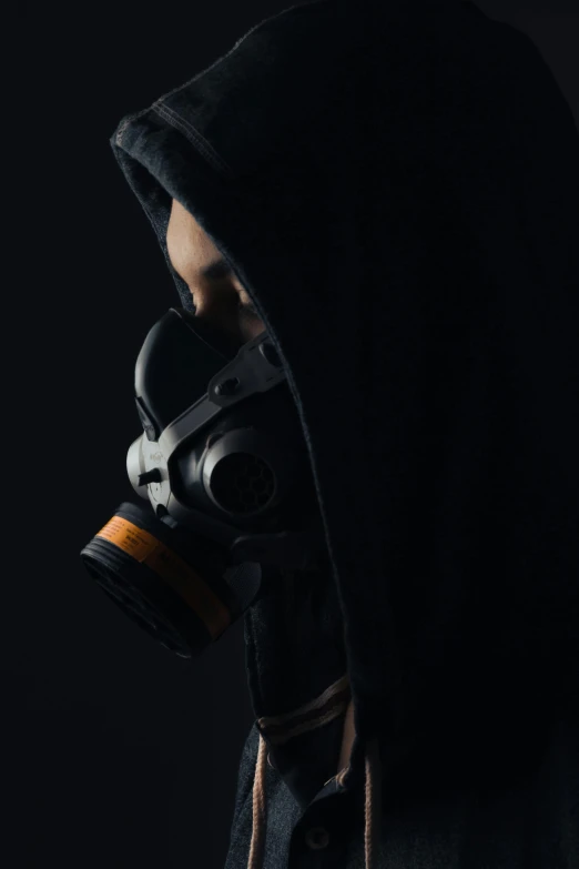 a person wearing a gas mask with a hood