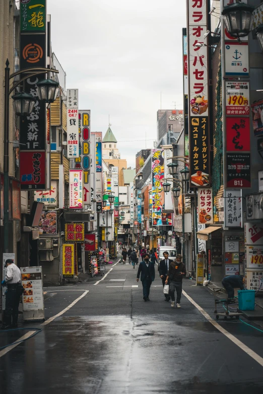 this is an empty street with people walking on it