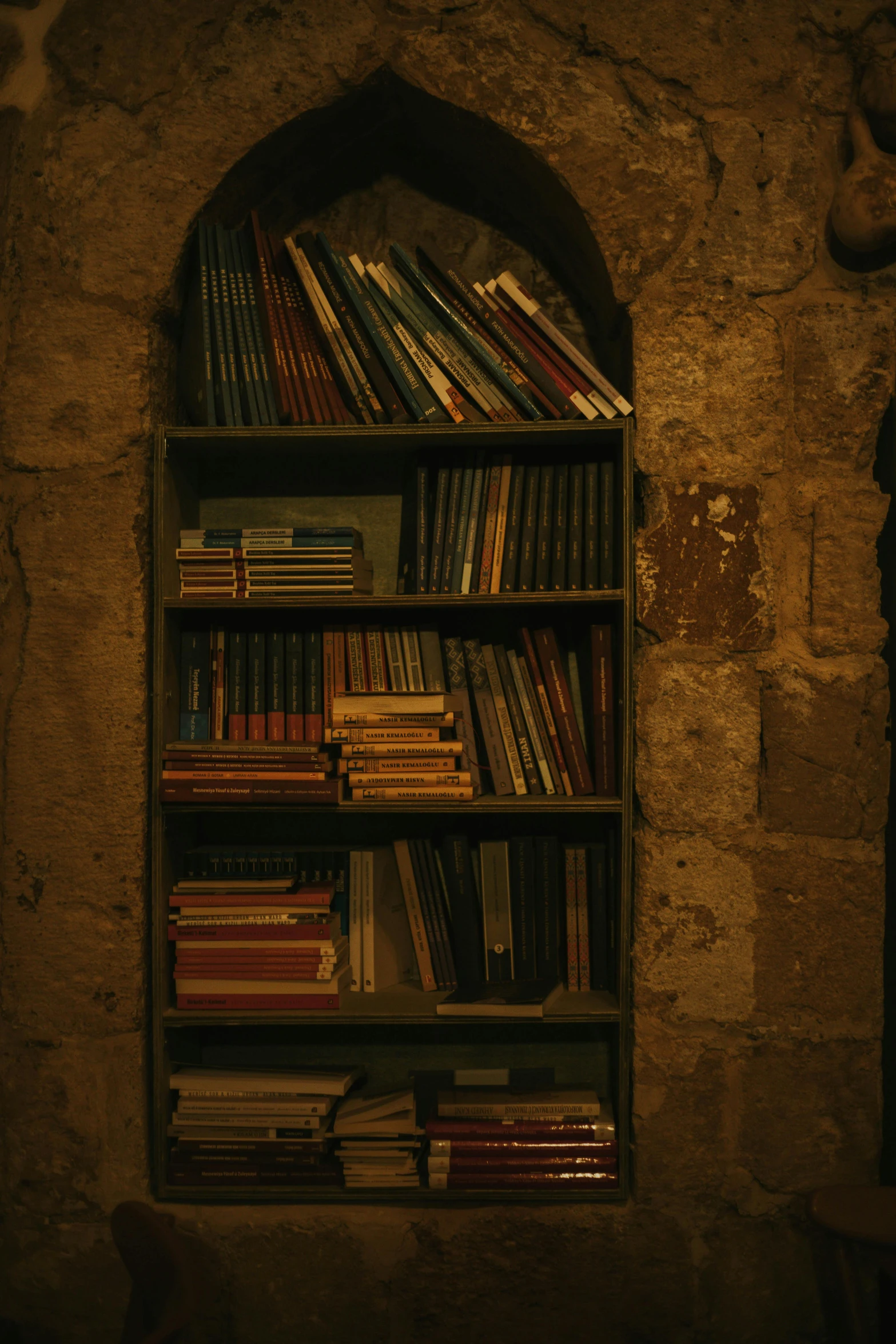 an old bookcase is filled with books and books