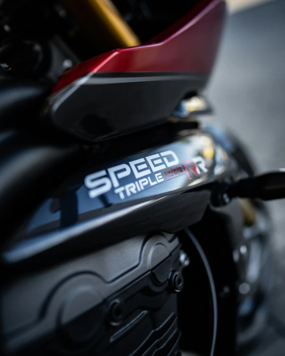 the logo of the sporty motorcyclist has been placed on the back end of a motorcycle
