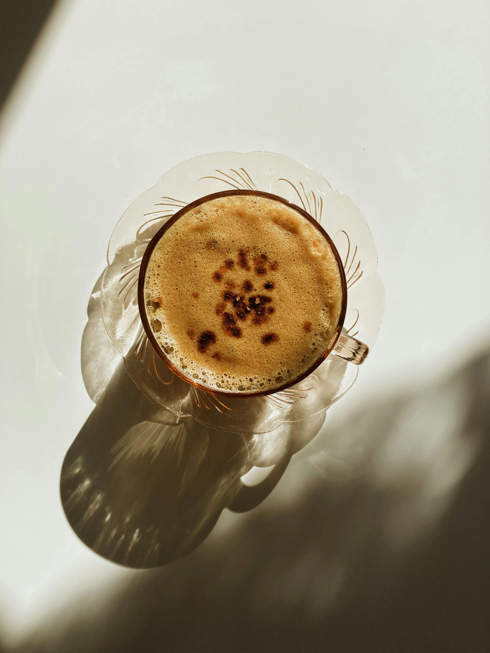 a cup of coffee with liquid on it