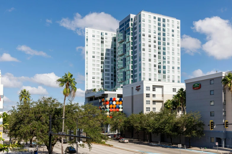 a large white building sitting next to a tall white one