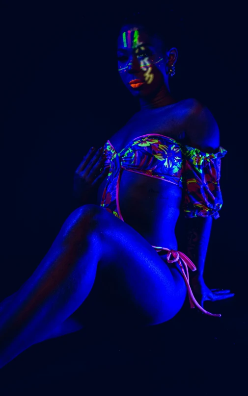 the neon glow of a woman is making her body glow