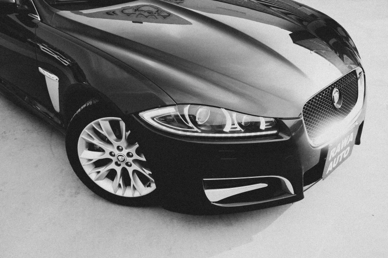 black and white pograph of a car's front hood