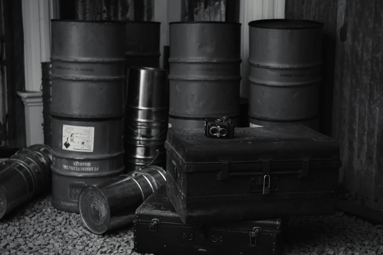 an assortment of different metal containers sitting next to each other