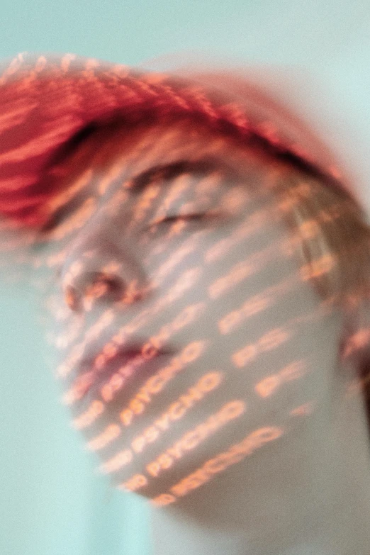 blurred portrait of a woman with red hair