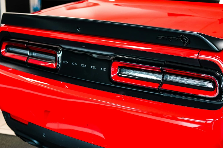 the taillight and bumper cover of a red jeep