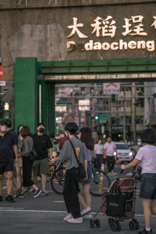 people walking and cross the street in the middle of the city