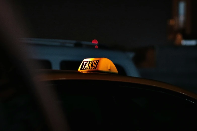 the top of a taxi cab with a license plate