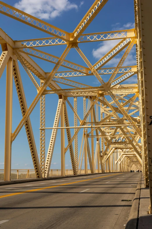 the view from behind a street in front of a bridge