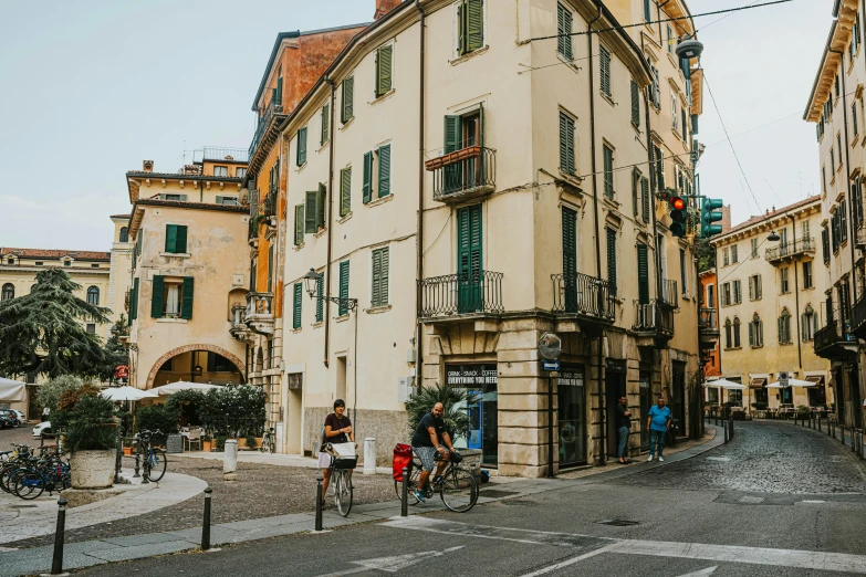 a cobblestone street with a traffic light on one pole