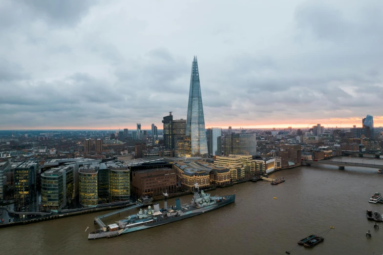 an aerial view of the cityscape including a cruise ship in the river