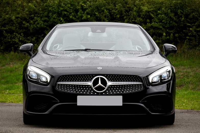 the front end of a black mercedes cla