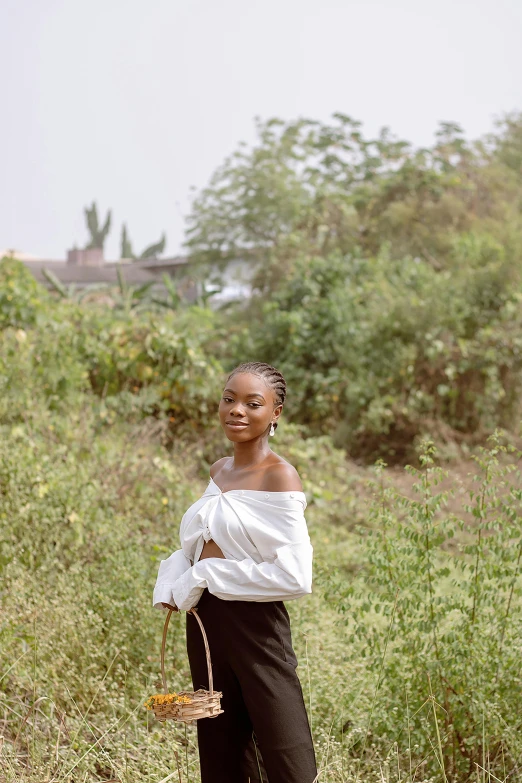 the girl is standing outside posing for a po