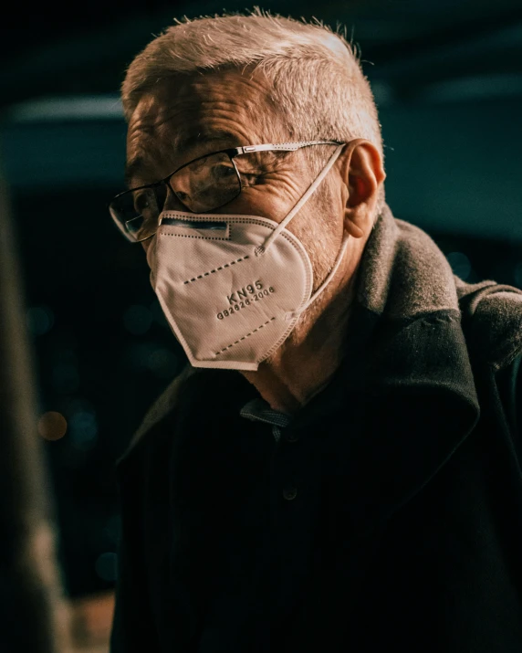 a man wearing a face mask with the words,