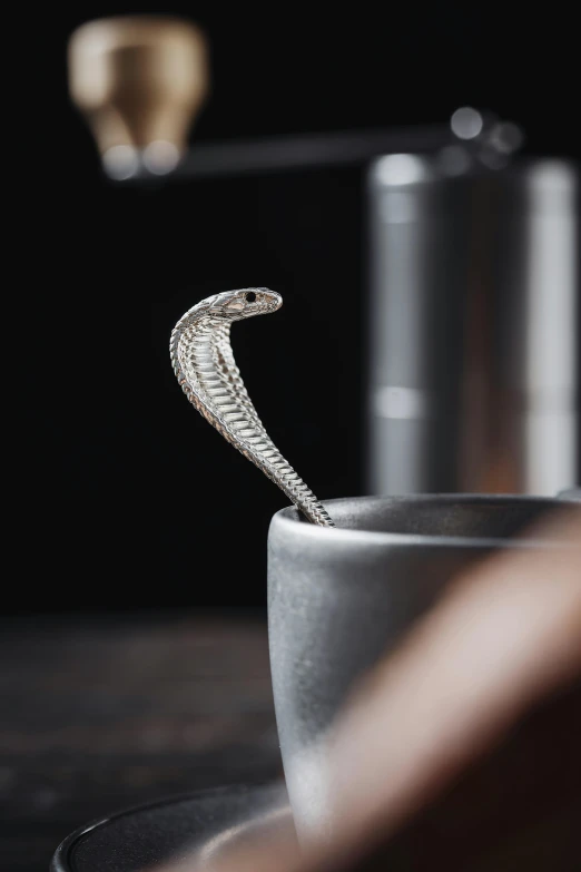 a metal ring that is standing on a bowl