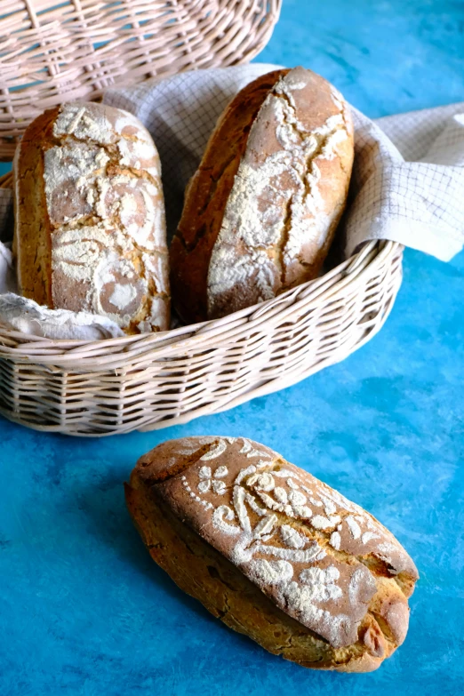 three pastries are sitting in a wicker basket