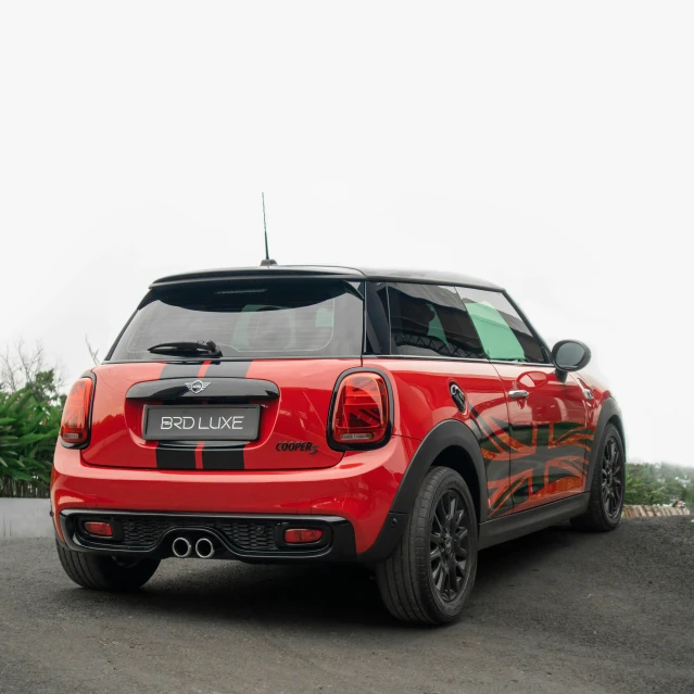 the back of a red car with black rims