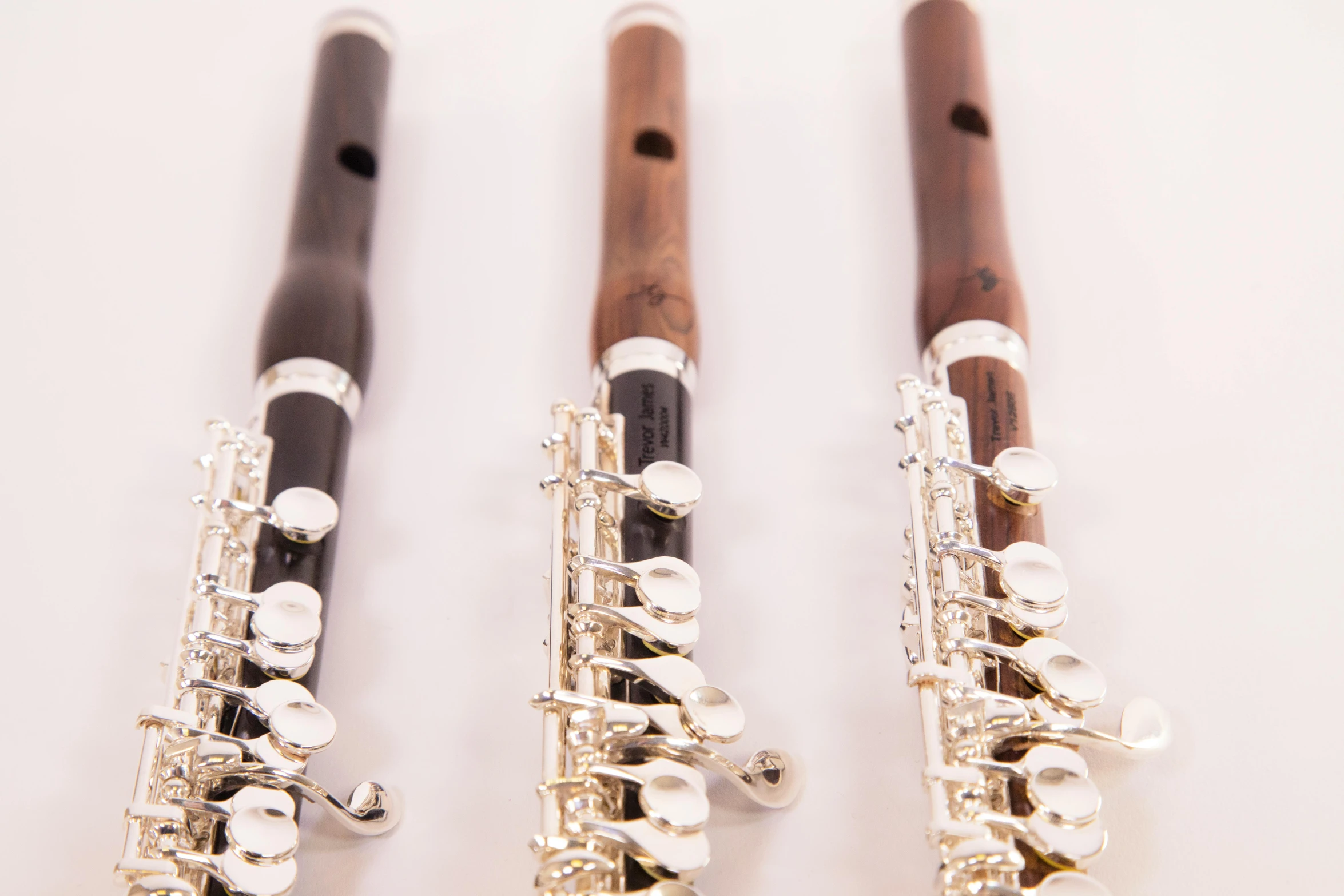 three flutes are lined up beside each other