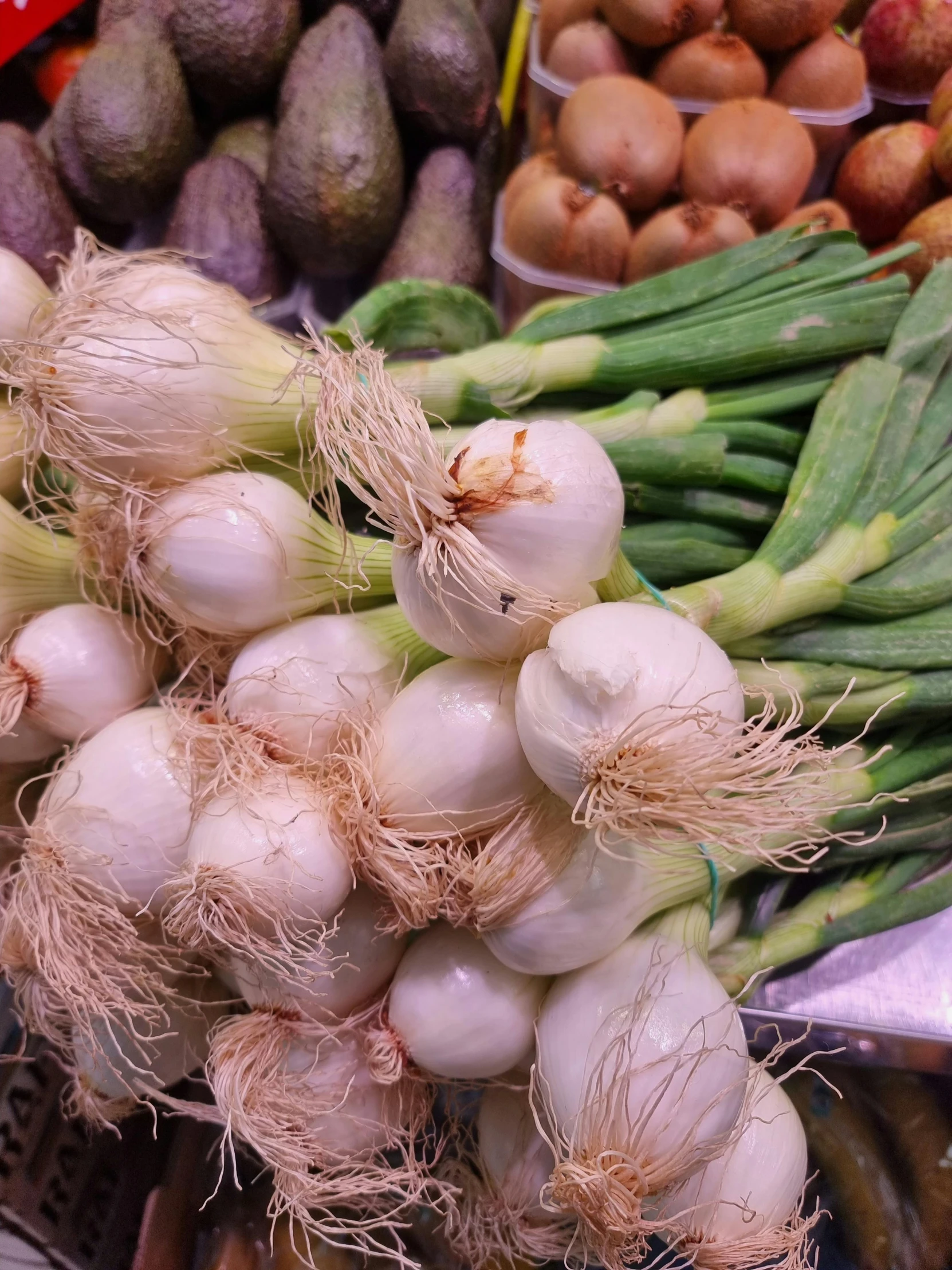 onions, asparagus and more vegetables for sale at a farmer's market