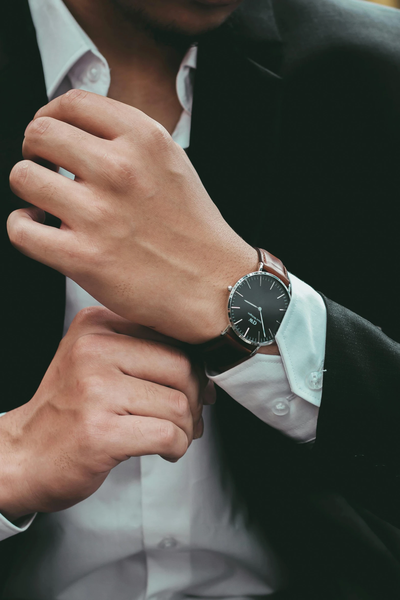 a man wearing a watch on his wrist