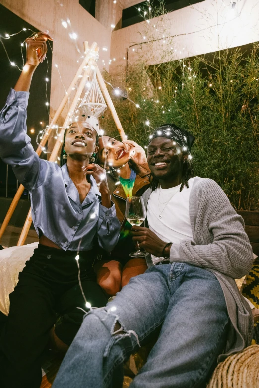 a couple of men are sitting down and smiling