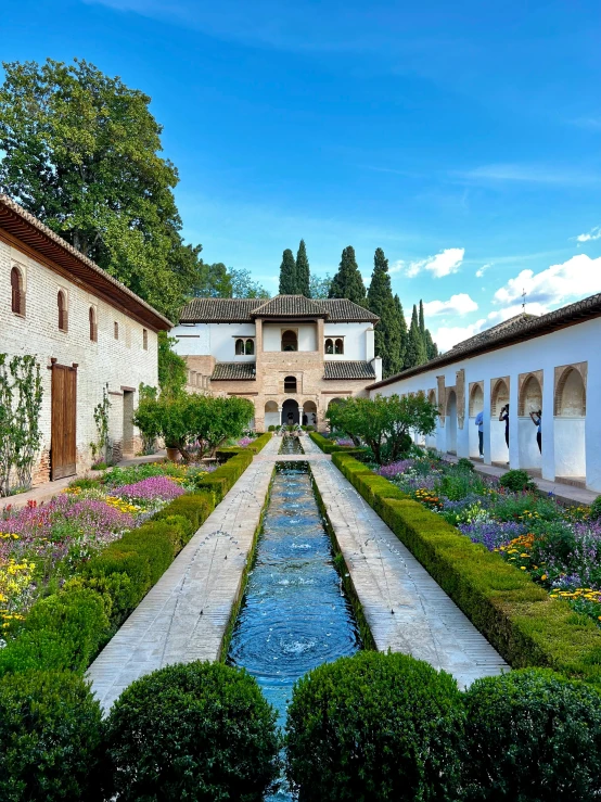 there is a long garden in front of a building