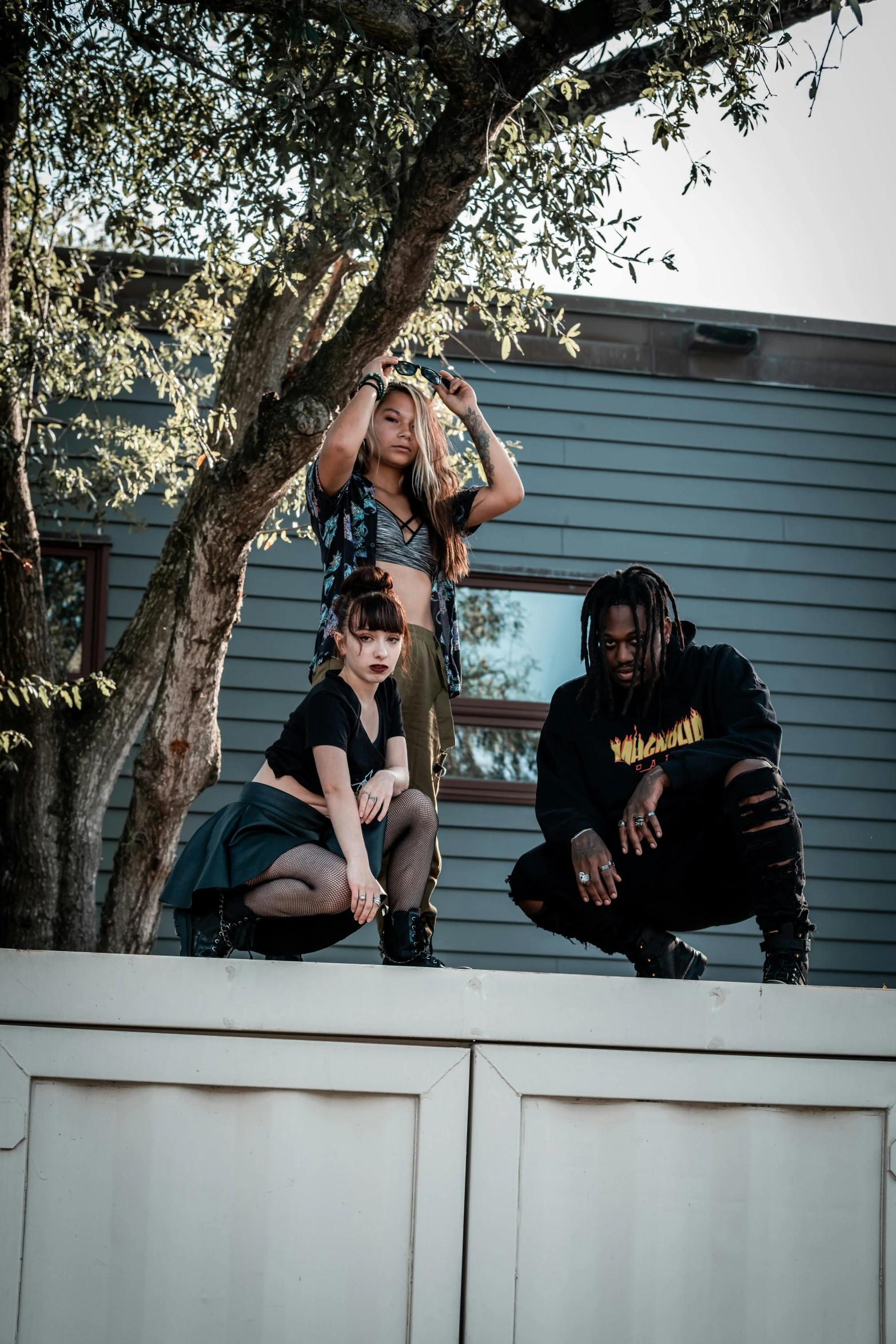 three children playing on the roof of a building