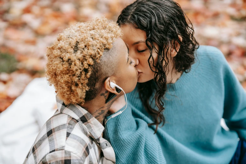 a woman and man in the fall with a scarp on