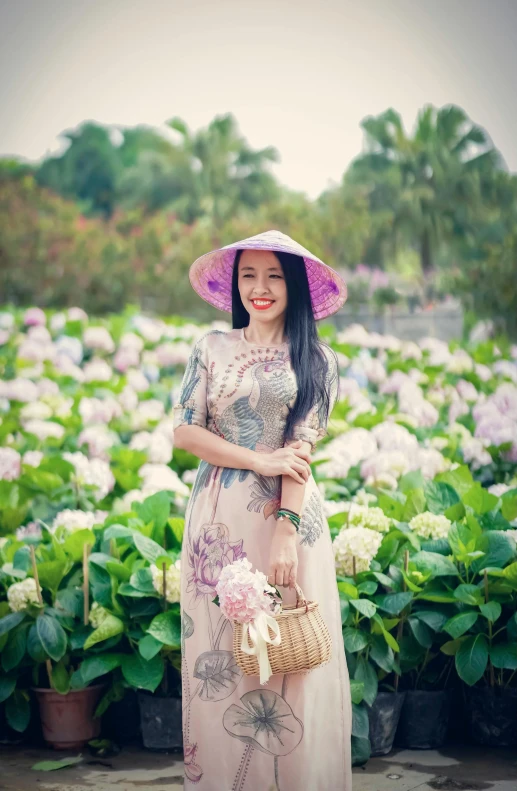 the woman is wearing a pink hat and dress