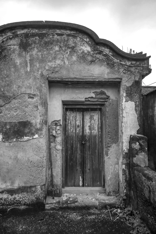 a very old building with a door and window