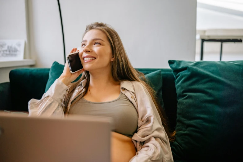 a beautiful young lady talking on a phone