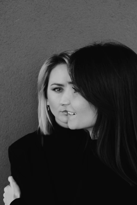 black and white po of woman's face with tooth brush