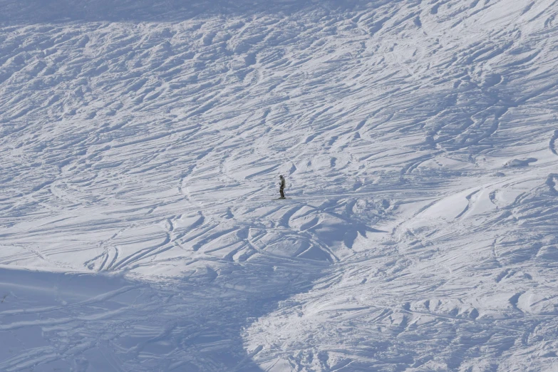 an uphill skier on the snow - capped mountain