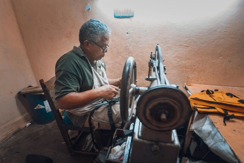 a man who is working on some machines