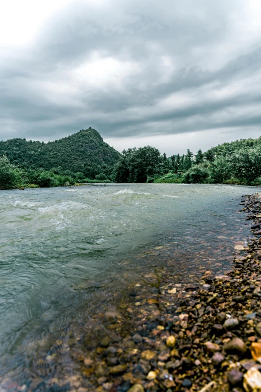 a calm body of water near some mountains