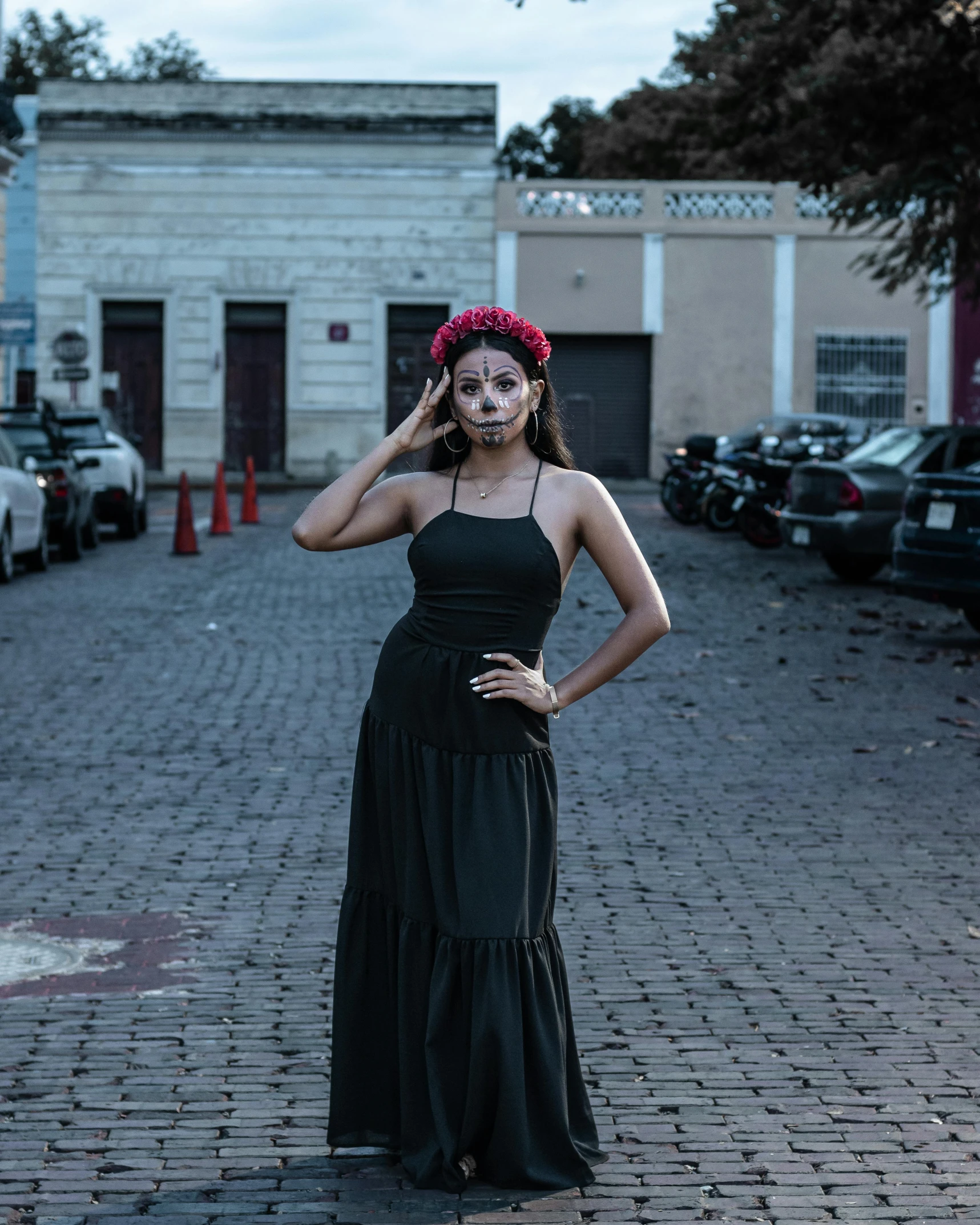 a woman in a black dress posing for the camera