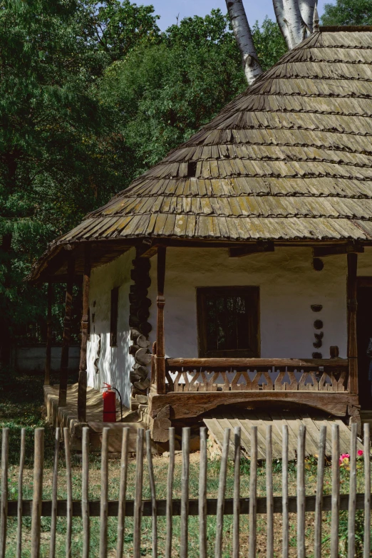 a rustic style house with a thatch roof