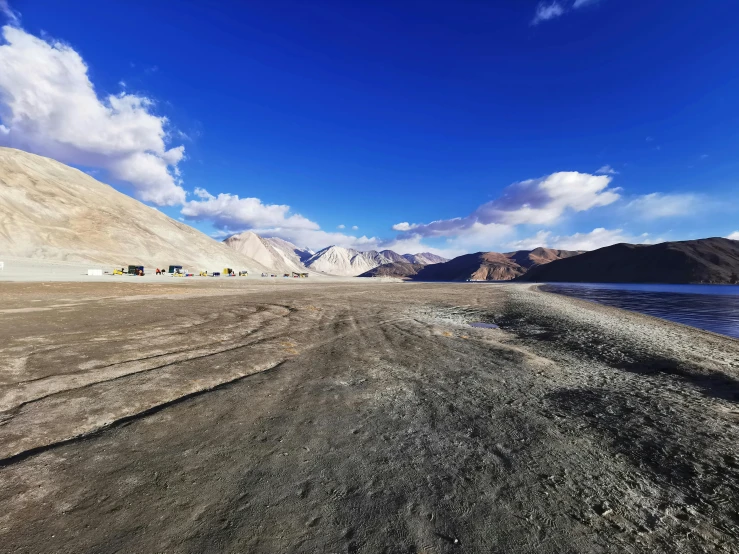 a scenic view with a road leading to a body of water