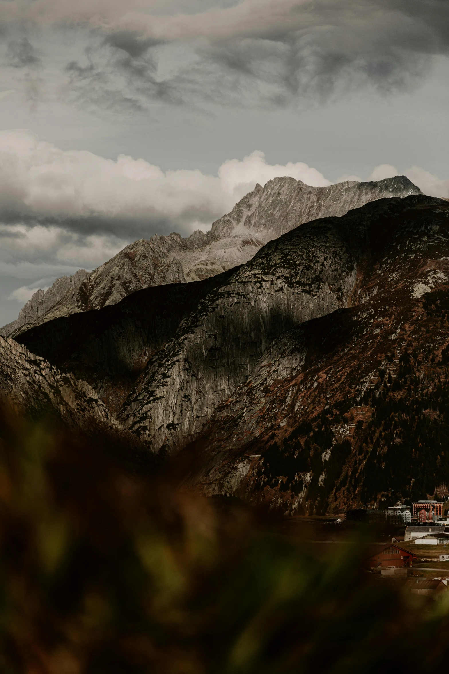 a snow covered mountain and a cloudy sky