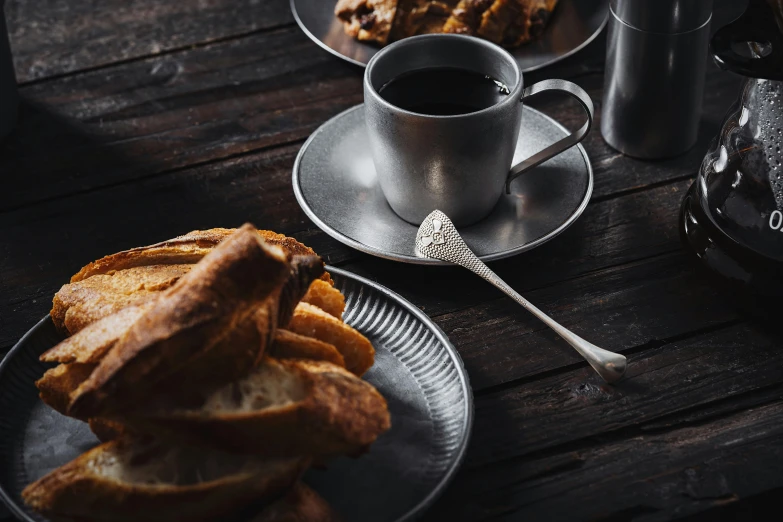 a table with plates and cups of coffee