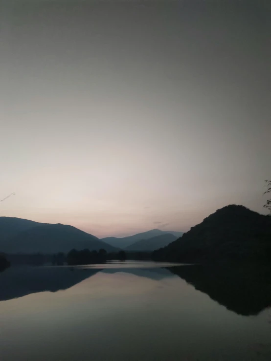 an airplane is flying over a small lake