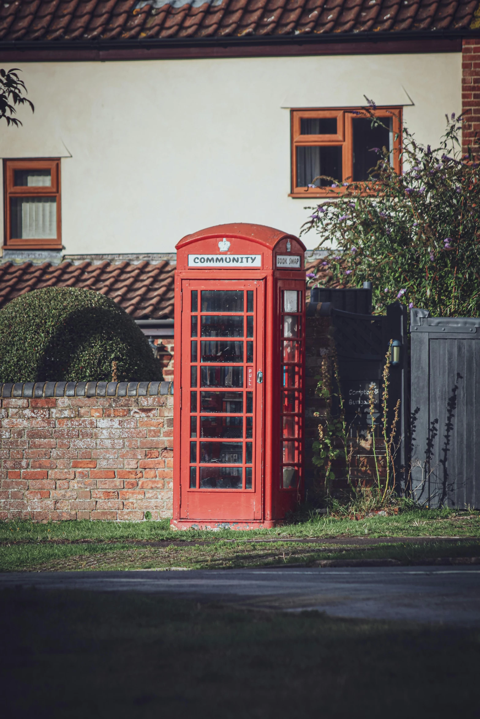 a telephone booth in front of a building