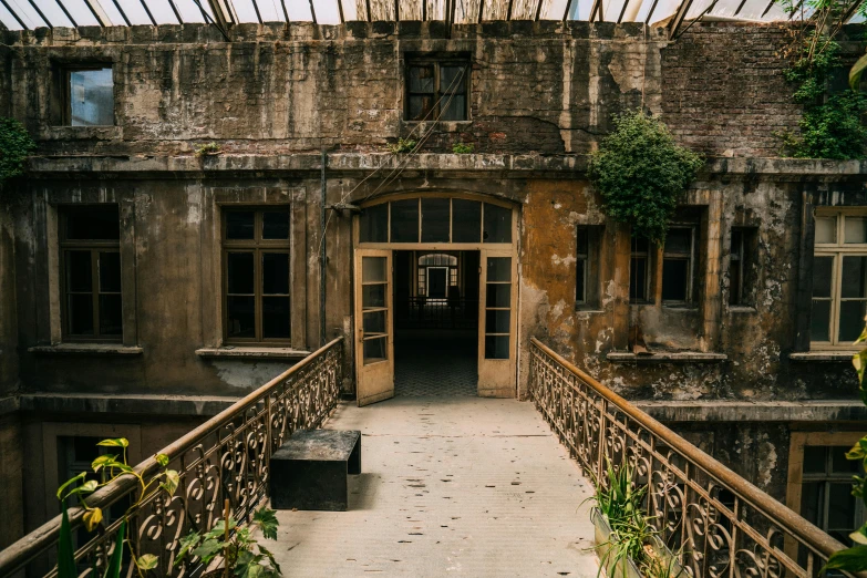 the walkway to the top floors leading up to a balcony