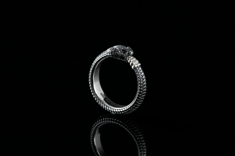 a fancy ring is on a black background