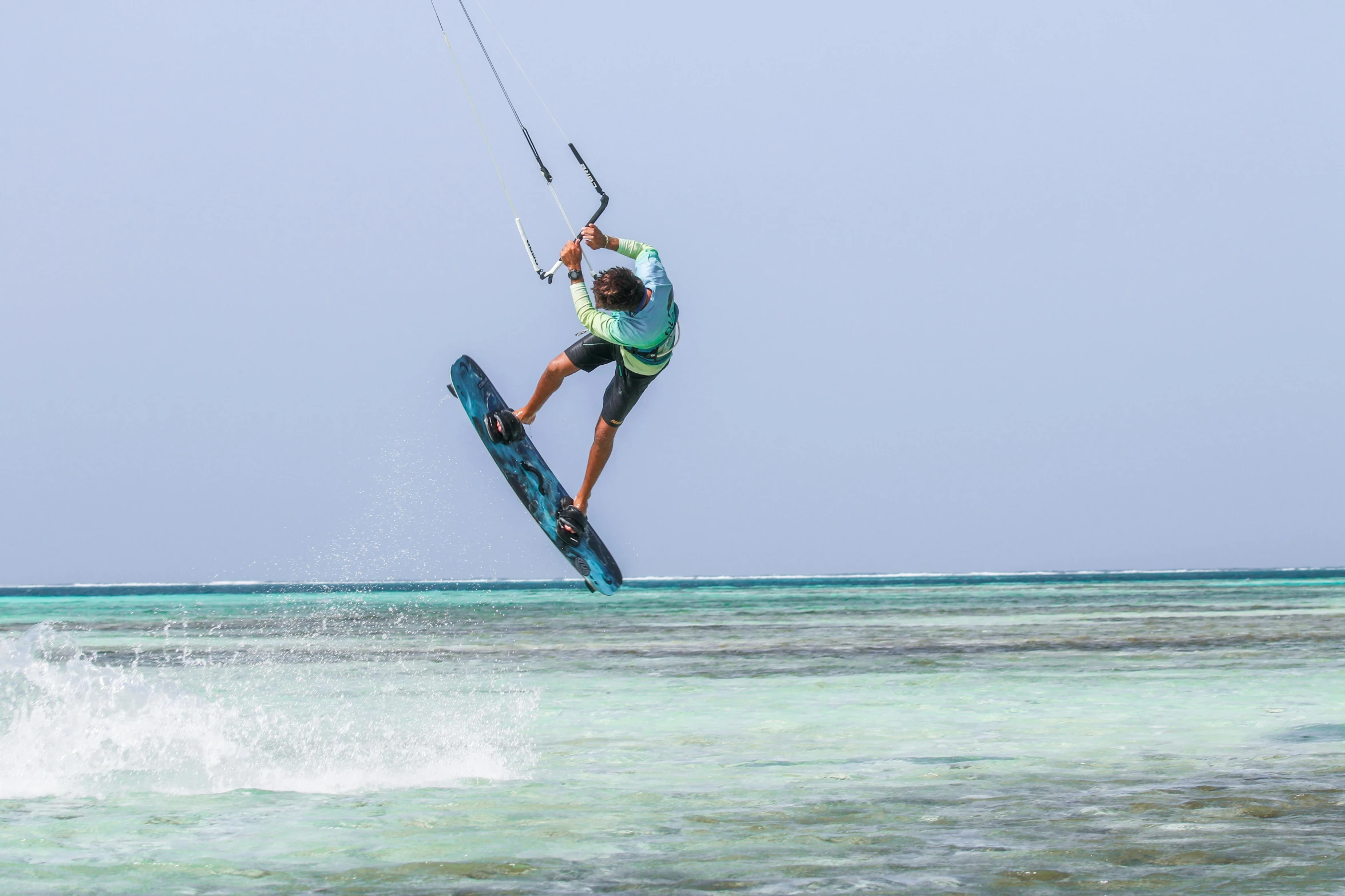 a man riding a surfboard on top of water