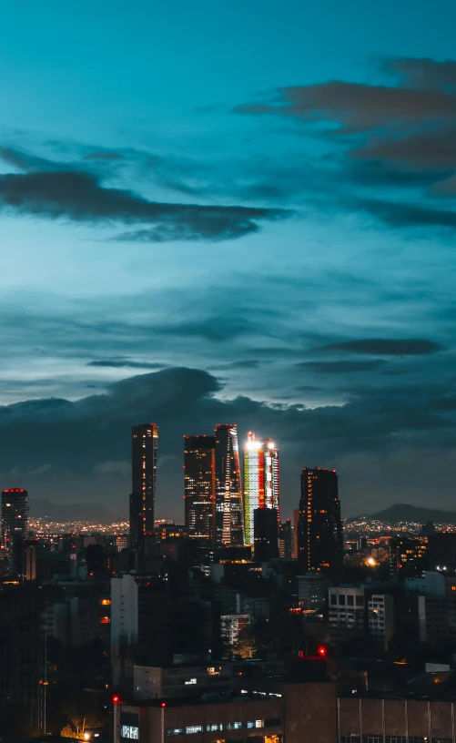 an urban city at night with lights and buildings