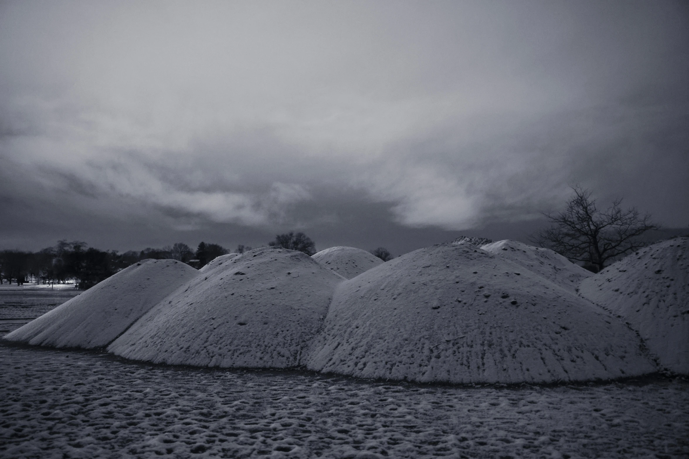 several piles of sand near one another